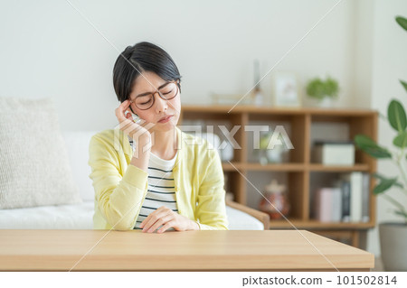 Woman with tired eyes, woman suffering from eye strain, woman suffering from migraine, woman suffering from anxiety, woman thinking about something Woman with tired eyes, woman suffering from eye strain, woman suffering from migraine, woman suffering from anxiety, woman thinking about something 101502814