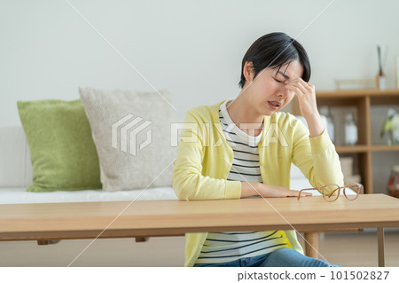 Woman with tired eyes, woman suffering from eye strain, woman suffering from migraine, woman suffering from anxiety, woman thinking about something Woman with tired eyes, woman suffering from eye strain, woman suffering from migraine, woman suffering from anxiety, woman thinking about something 101502827