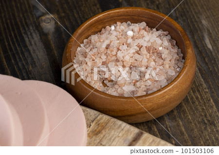 Pink natural salt on the table, close up 101503106