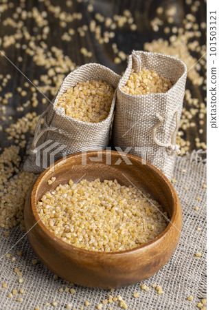 Fresh wheat porridge in a linen bag Fresh wheat porridge in a linen bag 101503121