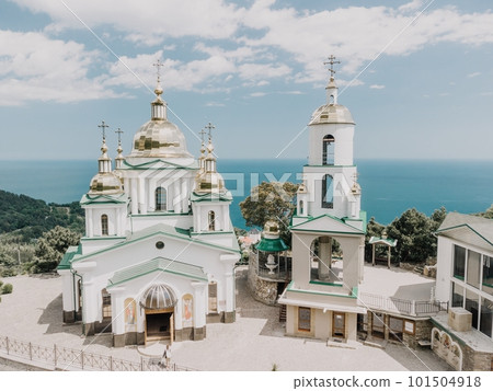 Christian church in the mountains above the sea. Temple of the Holy Archangel Michael in Oreanda. The southern coast of Crimea. Aerial view 101504918