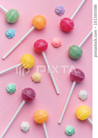 Sweet lollipops and candies on pink background Sweet lollipops and candies on pink background 101505086