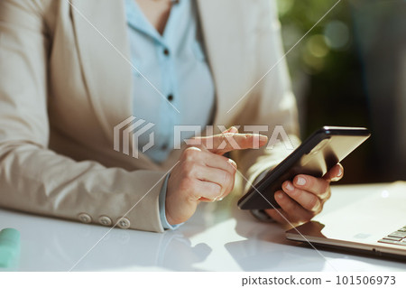 Modern accountant woman in green office using phone Modern accountant woman in green office using phone 101506973