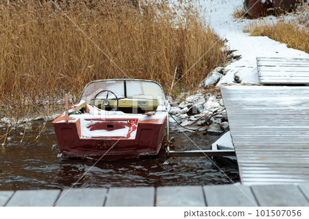 Boat at the pier. Cottage on the water, fishing pier, tourism. 101507056