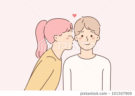 Little girl kisses lover on cheek for concept of first childhood love for boy friend 101507909