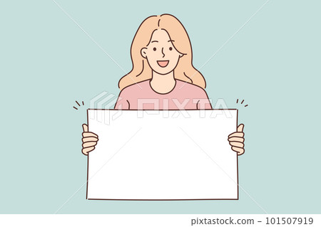 Woman holding blank white placard smiling and looking at camera demonstrating banner with copy space 101507919
