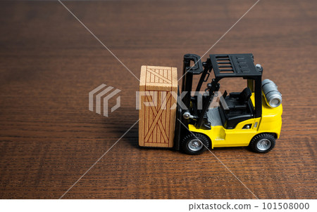 A forklift truck transports a wooden crate box. Trading transportation services. Import export. Warehousing. Tracking deliveries. Shipping. Packing and transportation logistics. 101508000