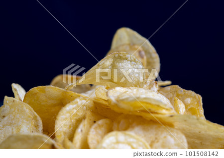 thin potato chips with spices, close up thin potato chips with spices, close up 101508142