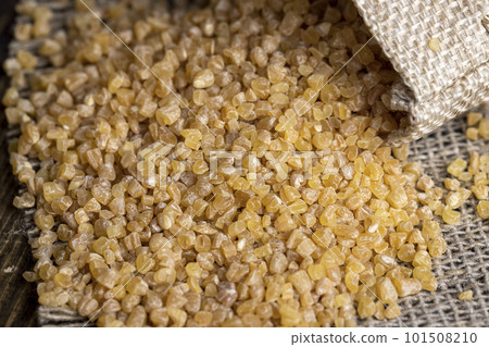 Not cooked wheat porridge in a linen bag 101508210
