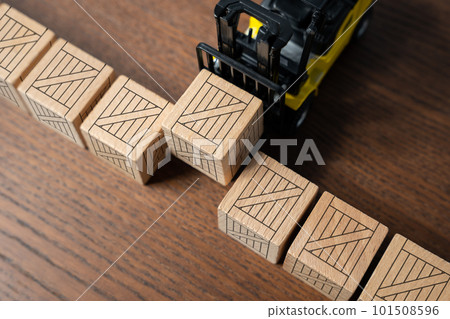 The forklift transports wooden crates. Warehousing. Mass production. Delivery of parcels and orders. Trading traffic. Transportation logistics. Line of boxes with goods. Conveyor belt concept. The forklift transports wooden crates. Warehousing. Mass production. Delivery of parcels and orders. Trading traffic. Transportation logistics. Line of boxes with goods. Conveyor belt concept. 101508596