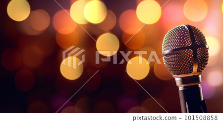 studio microphone in neon lights. sound recording equipment on bokeh background. Podcast,recording music concept microphone 101508858