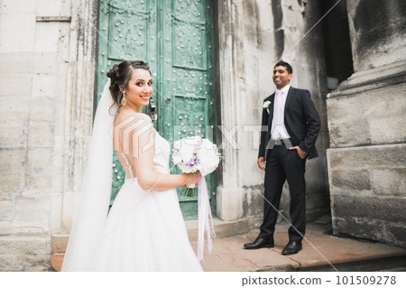 Gorgeous happy couple standing close to each other and looking in eyes Gorgeous happy couple standing close to each other and looking in eyes 101509278