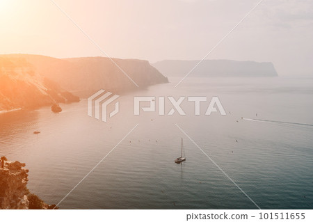 Aerial view from above on calm azure sea and volcanic rocky shores. Small waves on water surface in motion blur. Nature summer ocean sea beach background. Nobody. Holiday, vacation and travel concept Aerial view from above on calm azure sea and volcanic rocky shores. Small waves on water surface in motion blur. Nature summer ocean sea beach background. Nobody. Holiday, vacation and travel concept 101511655