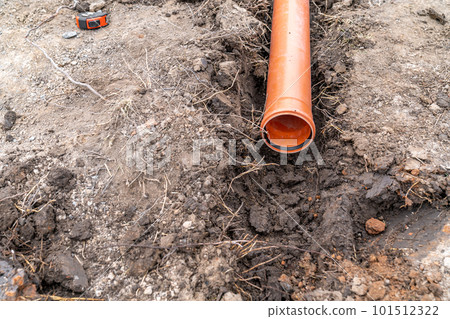 plastic pvc waste sewer pipe in the ground. construction site plastic pvc waste sewer pipe in the ground. construction site 101512322