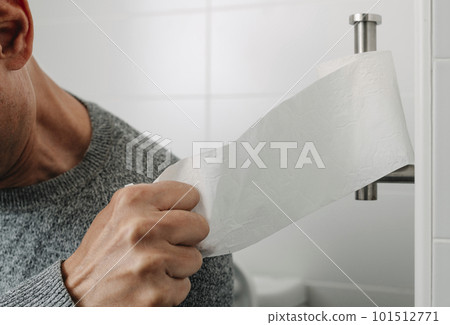 takes a piece of paper sitting in the toilet 101512771