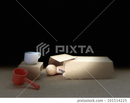 Homeless image _ doll sleeping in cardboard 101514225