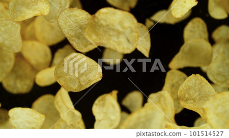 Potatoes fried chips in freeze motion, isolated on black background 101514527