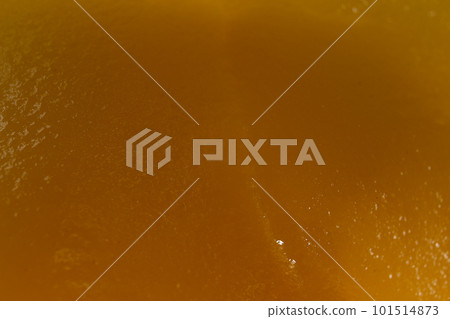 Honey orange textured background, close-up macro view Honey orange textured background, close-up macro view 101514873