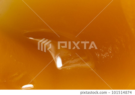 Honey orange textured background, close-up macro view 101514874