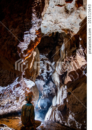 person staring at white flowstone person staring at white flowstone 101515643