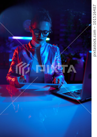trendy business woman in glasses with tablet PC and laptop 101516487