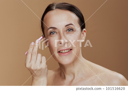 Portrait of smiling modern woman isolated on beige background Portrait of smiling modern woman isolated on beige background 101516620