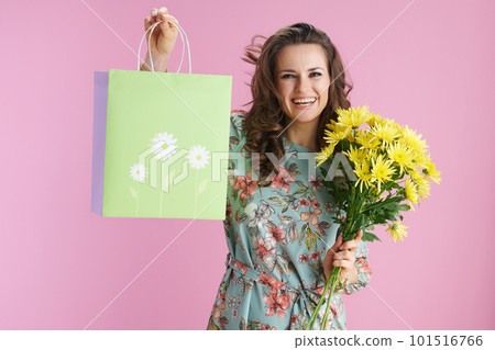 happy elegant woman with long wavy brunette hair on pink 101516766