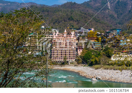 Beautiful River Ganga in Rishikesh surrounded by ashrames and temples building. Pure natural clean river water. Beautiful River Ganga in Rishikesh surrounded by ashrames and temples building. Pure natural clean river water. 101516784