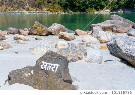 Beautiful River Ganga near Rishikesh with stones and sand beach and Mountains. Pure natural clean river water. Beautiful River Ganga near Rishikesh with stones and sand beach and Mountains. Pure natural clean river water. 101516786