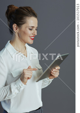 happy modern 40 years old business woman isolated on grey 101517013