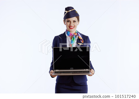 smiling female stewardess on showing laptop blank screen smiling female stewardess on showing laptop blank screen 101517240