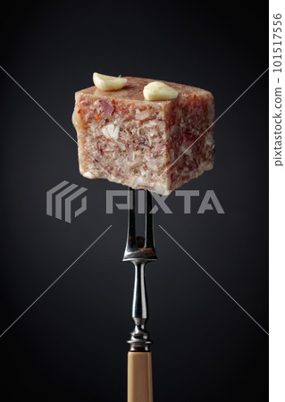 Headcheese on a fork. Headcheese on a fork. 101517556