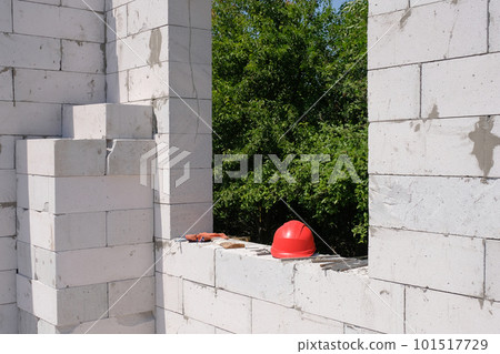 Construction site of a house under construction from white gas blocks. Building a house on the site 101517729