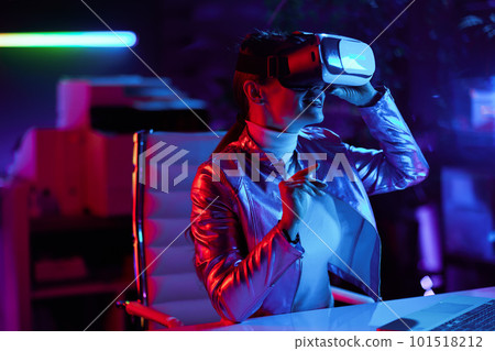 smiling stylish female in vr headset in modern office 101518212