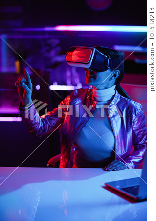 smiling woman in virtual reality goggles in office smiling woman in virtual reality goggles in office 101518213