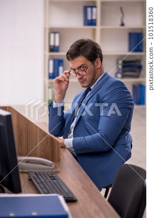 Young male employee working in the office Young male employee working in the office 101518360