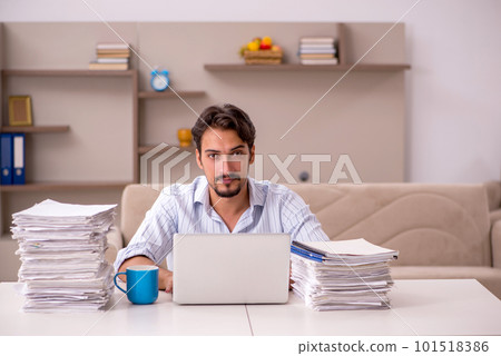 Young businessman employee working from home during pandemic 101518386