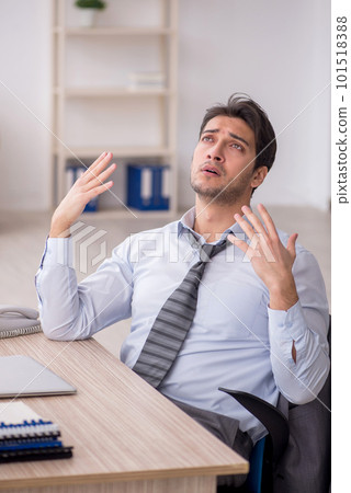 Young male employee working in the office 101518388