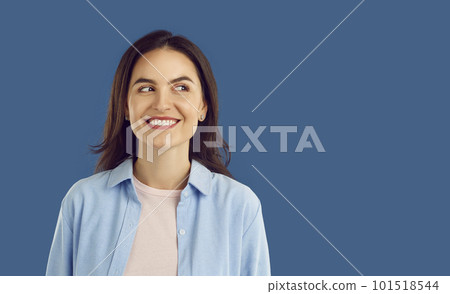 Happy young woman looking at copy space side, thinking about something and smiling 101518544