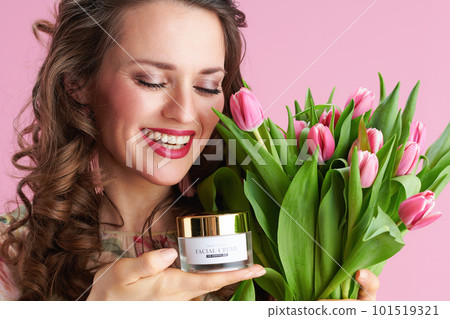 smiling elegant female in floral dress on pink smiling elegant female in floral dress on pink 101519321