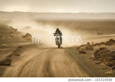 A Lone Rider on a Motorcycle Speeding through a Challenging Desert Terrain Kicking up Dirt and Gravel in the Air A Lone Rider on a Motorcycle Speeding through a Challenging Desert Terrain Kicking up Dirt and Gravel in the Air 101519590