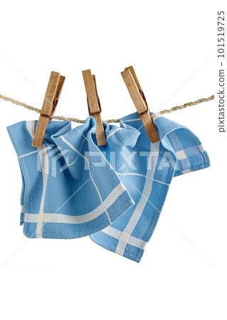 Blue kitchen napkin hangs on clothespins isolated on white background Blue kitchen napkin hangs on clothespins isolated on white background 101519725