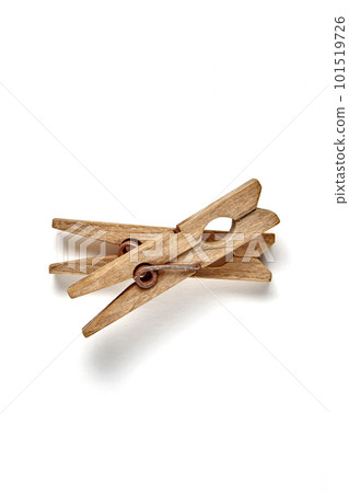 Two shabby vintage wooden clothespins isolated on a white background Two shabby vintage wooden clothespins isolated on a white background 101519726