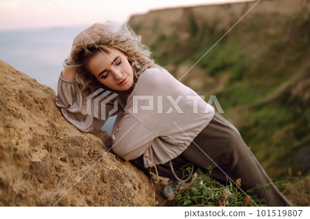Young woman resting in nature. People, lifestyle, relaxation and vacations concept. Fashion. Young woman resting in nature. People, lifestyle, relaxation and vacations concept. Fashion. 101519807