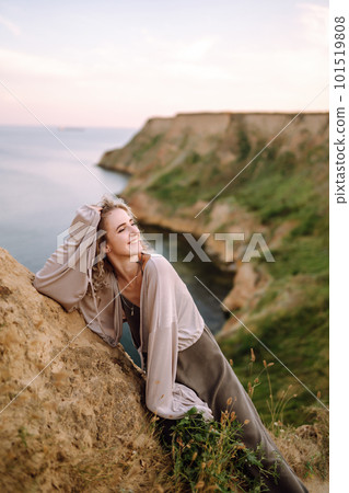 Young woman resting in nature. People, lifestyle, relaxation and vacations concept. Fashion. Young woman resting in nature. People, lifestyle, relaxation and vacations concept. Fashion. 101519808
