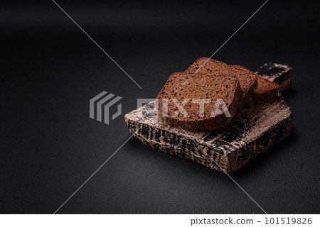 Loaf of fresh crispy brown bread with grains and seeds 101519826