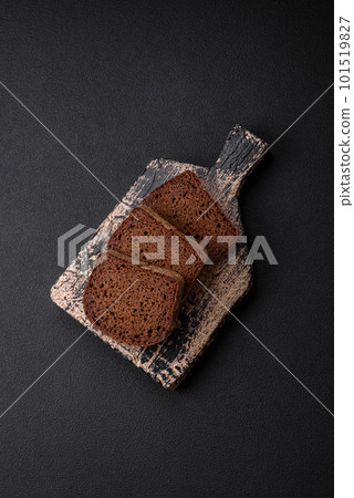 Loaf of fresh crispy brown bread with grains and seeds Loaf of fresh crispy brown bread with grains and seeds 101519827
