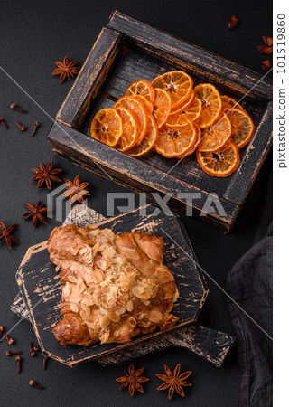 Fresh crispy croissant with almond chips and chocolate filling Fresh crispy croissant with almond chips and chocolate filling 101519860