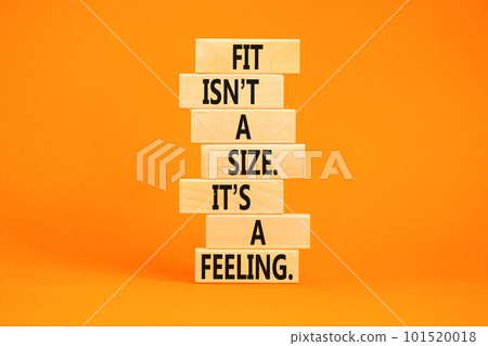 Fit, size or feeling symbol. Concept words Fit is not a size it is a feeling on wooden blocks. Beautiful orange table orange background. Copy space. Motivational fit size or feeling concept. Fit, size or feeling symbol. Concept words Fit is not a size it is a feeling on wooden blocks. Beautiful orange table orange background. Copy space. Motivational fit size or feeling concept. 101520018