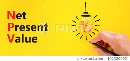 NPV net present value symbol. Concept words NPV net present value on yellow paper on a beautiful yellow background. Orange light bulb icon. Business and NPV net present value concept. Copy space. 101520065